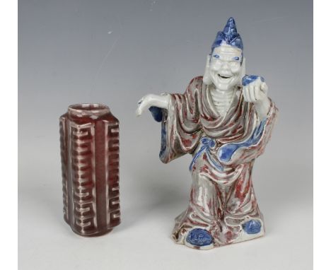 A Chinese porcelain sang-de-boeuf archaistic Cong vase, of typical square form with circular rim, each corner moulded in reli