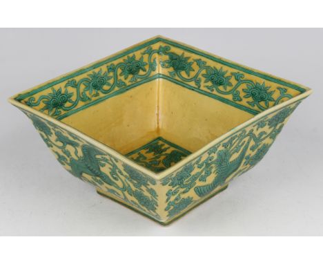 A Chinese Ming style yellow and green decorated porcelain bowl, mark of Jiajing but probably Qing dynasty, of flared square f