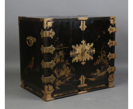 A Japanese lacquer cabinet, Edo period, the doors and sides decorated with gilt pavilions, landscapes, flowers and birds on a