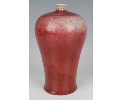 A Chinese sang-de-boeuf glazed porcelain meiping, covered in a streaky oxblood glaze, height 22.2cm.Buyer’s Premium 29.4% (in