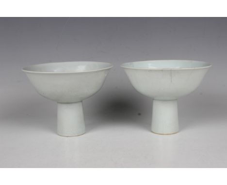 A pair of Chinese white glazed porcelain dragon stem cups, mark of Yongzheng but probably later Qing dynasty, each circular b