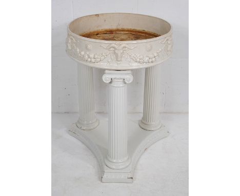 A 19th Century ceramic planter by Gunnar Wennerberg, with circular top decorated with ram's heads and swags, raised on three 