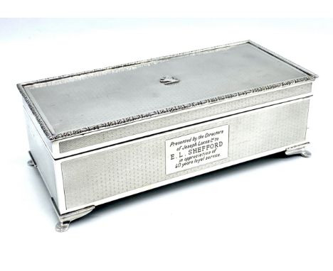 A Birmingham 1960 silver cigarette box with all over engine turned decoration, with inscription presented by the directors of