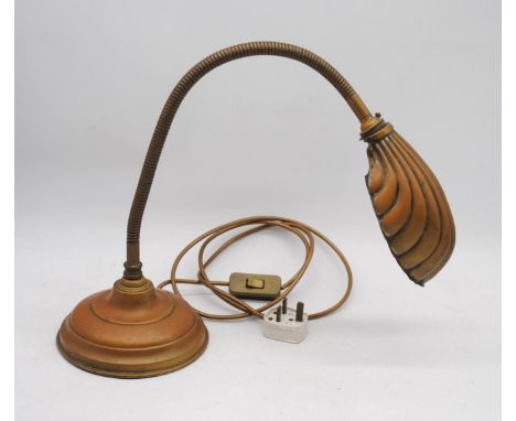 An antique copper adjustable desk lamp, with scalloped shell shade
