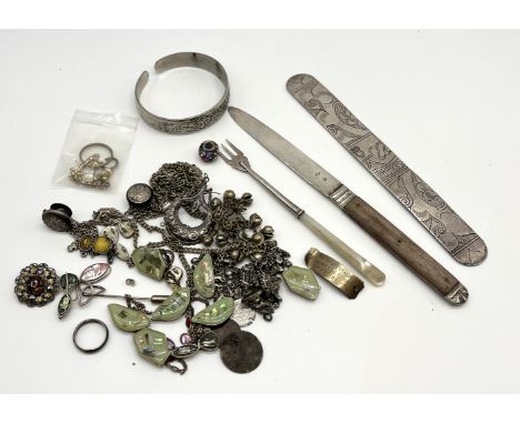 A silver bladed knife, a silver and mother of pearl fork and a collection of assorted costume jewellery etc. 
