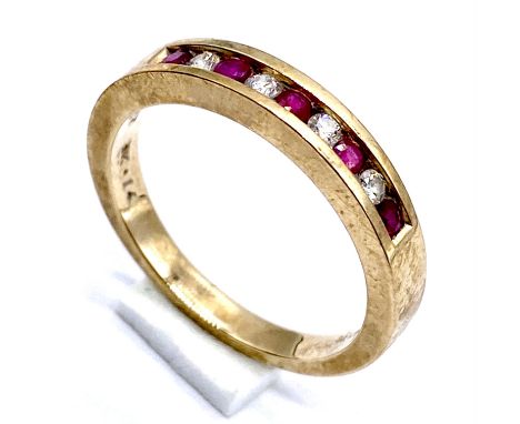 A 9ct gold ruby and diamond half eternity ring size P, 3.5g total weight.