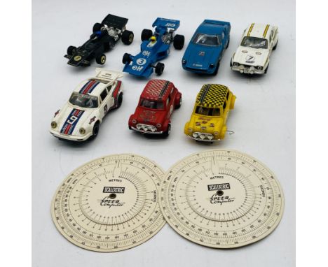 A small collection of vintage Scalextric cars including two F1 cars, two mini's (one A/F) and three racing cars etc