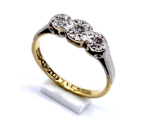 An 18ct gold illusion set diamond three stone diamond ring, size K, 2.3g total weight.