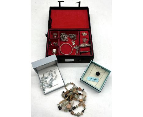 A collection of assorted vintage and fashion jewellery to include silver bangle, chains, filigree brooches etc.