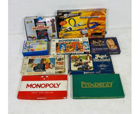 A collection of boxed board games and toys including Corgi Wheelz Streakerz, MB Games Downfall, Battership, Buffy The Board G