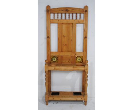 An antique pine hallstand, with ceramic tiles inset to back - length 84cm, depth 28cm, height 198cm