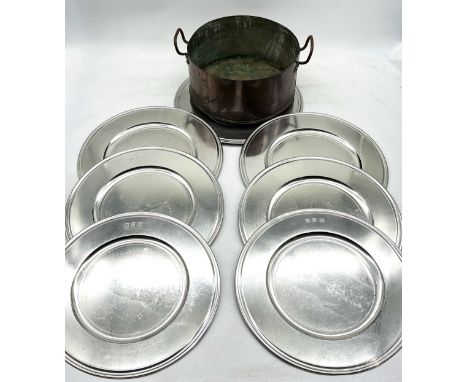 A set of seven John Somers pewter plates with orginal bags along with a vintage copper pan