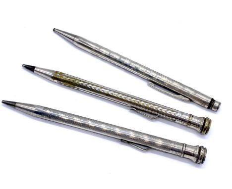 A vintage sterling silver pencil and two silver-plated pencils.