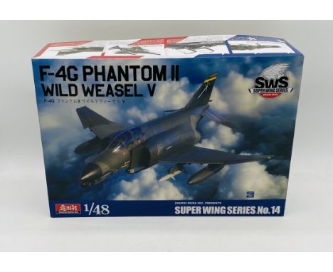 A boxed Zoukei-Mura Inc. Super Wings Series No.14 (SWS) "F-4G Phantom II Wild Weasel V" plastic model kit - 1:48 scale, conte