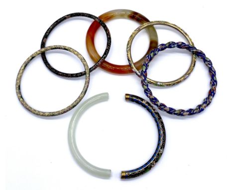 A collection of vintage cloisonne enamel bangles one with half jade to enamel, and an agate bangle A/F.