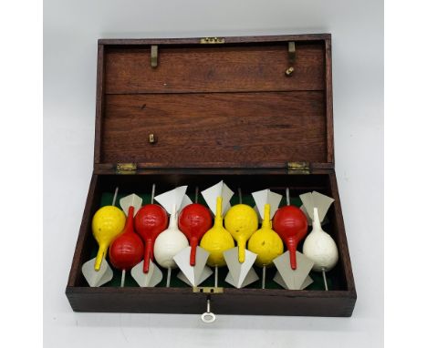 A set of vintage lawn darts with replacement flights, stored in lockable box
