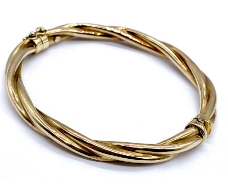 A 9ct gold hinged twisted bangle, 10.3g.