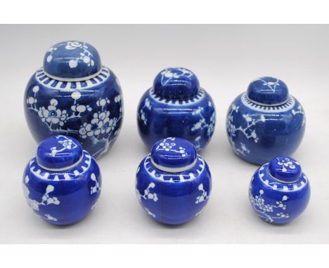 A collection of Oriental blue and white ceramic ginger jars, with lids - one lid restored