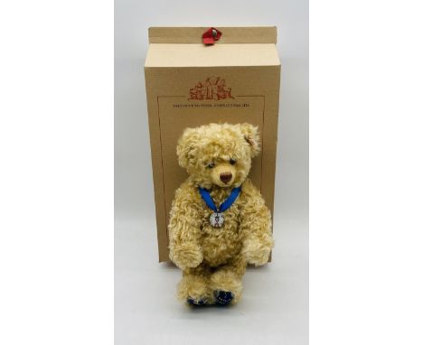 A limited edition boxed Steiff "Coronation Bear" teddy bear with royal blue velvet feet embroidered with St.Edwards Coronatio