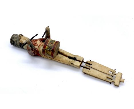 A jointed bone figure of a Napoleonic age drummer in British uniform (probably prisoner of war work)