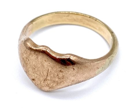 A vintage gent's gold shield shape signet ring, tests as 9ct, Size Y, 7.9g.