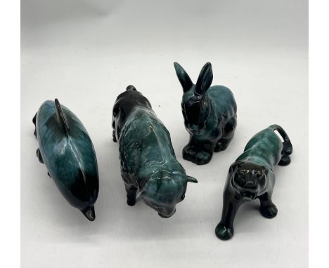 A collection of vintage Blue Mountain Ware Ceramic animal figurines to include Panther, buffalo, Dolphin and Rabbit.