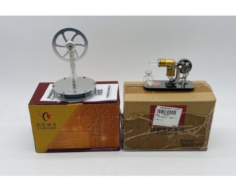 Two boxed D Star Robert Stirling Engine Models, manufactured in China including a Vacuum/Flame Licker Engine