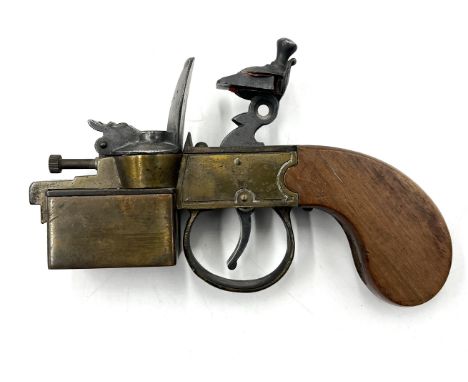 A Dunhill Tinder Pistol table lighter in the form of a flintlock pocket pistol, with Patent Number 592139