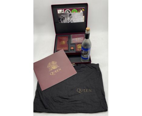 A Queen Live At The Rainbow box set, to comprise the 12 inch collection, pin and sleeve badges, VHS tape, poster and T shirt,