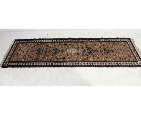 An Aztec pattern runner with geometric border - 274cm x 68cm