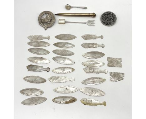 A collection of assorted mother of pearl carved counters, a silver salt spoon, a silver fork etc.