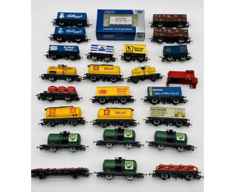 A collection of unboxed model railway OO gauge rolling stock including boxed Dapol Buffers Model Railways wagon (Axminster - 