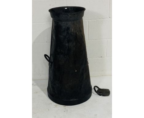 A vintage weathered metal milk churn - no base and handle loose but present