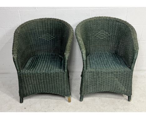 A pair of Lloyd Loom style wicker armchairs
