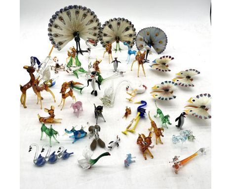 A collection of assorted vintage glass animals including hand painted peacocks and butterflies