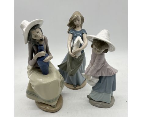 Three Nao figurines (one has damage to rabbits' ear)