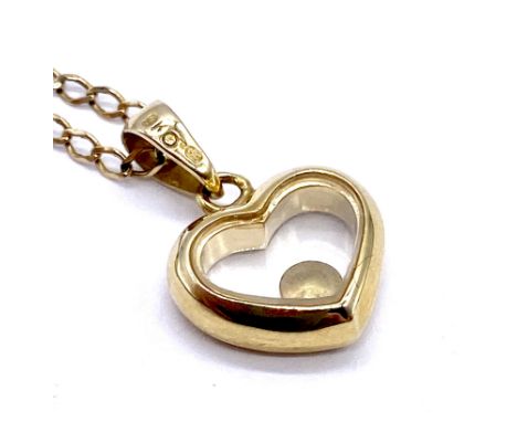 A vintage 9ct gold heart shaped pendant set with solitaire diamond on 9ct gold chain, 48cm total length, 2.8g total weight. 