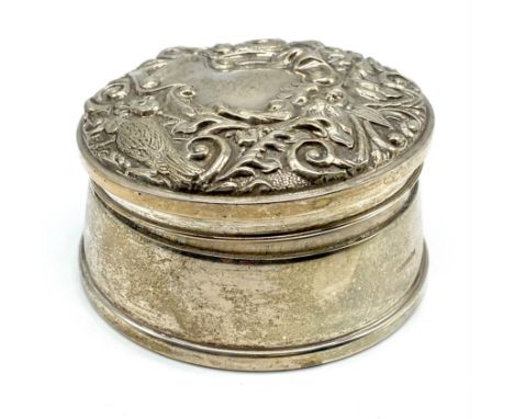 A Birmingham silver 1990 trinket box with black velvet lining, the top decorated with birds.