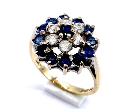 A 9ct gold sapphire and cubic zirconia cluster ring, size K 3.0 total weight.