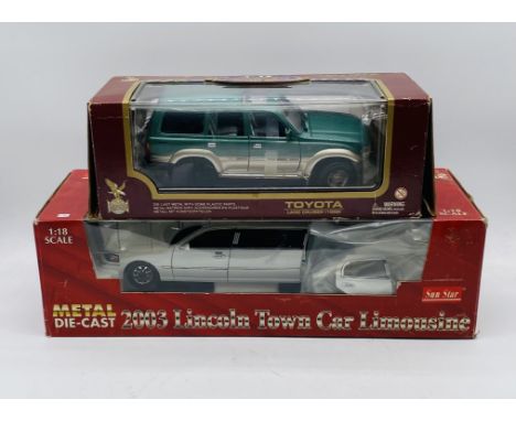 A boxed Sun Star 2003 Lincoln Town Car Limousine die-cast model, along with a Road Legends Toyota Land Cruiser (1992)  - both