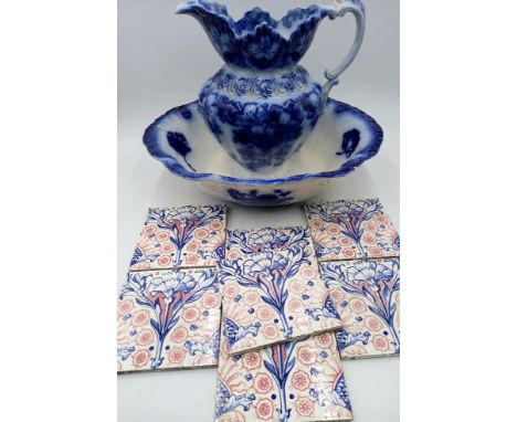 A vintage blue and white jug and basin A/F, and a set of seven antique tiles.