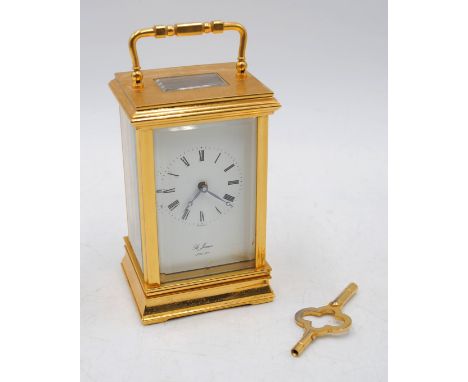 A 'St. James' brass carriage clock, with key