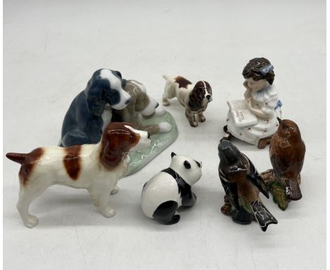 A collection of animal figurines by Beswick and Nao including a Panda, Spaniels etc, along with a Royal Doulton Storytime fig