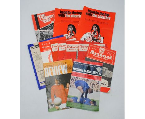 A small collection of vintage football programs, including Bournemouth & Boscombe 1957 - 1958, Arsenal 1958 - 59, Exeter City