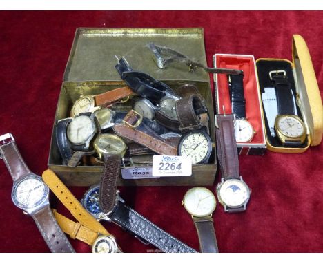 A tin containing vintage gentleman's wristwatches with leather straps to include: Smiths Empire, Pulsar, Junghans, Timex, etc
