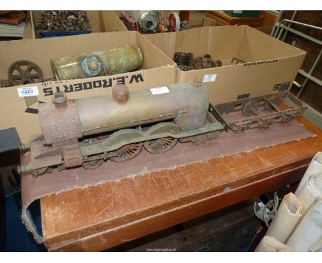 Two boxes of model live steam engine components including a 2 1/2" gauge 4 - 4 - 2 tender locomotive chassis with cylinders, 