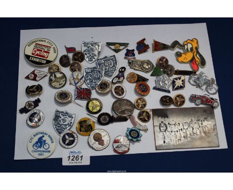 A quantity of cycling badges including enamel and hallmarked silver plus a copper engraved plate of 'Hereford & District Whee