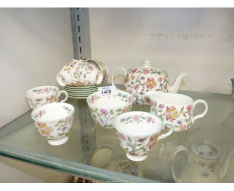 A Minton 'Haddon Hall' part tea set to include teapot, seven cups and six saucers, milk jug and sugar bowl.
