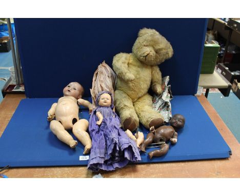 A vintage straw filled jointed Teddy Bear with leather pads and vintage Germany dolls in Taffeta clothing (in need of attenti