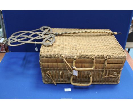 A fine early 20th century split cane hamper 20" long, plus a 19th century cane carpet beater 20" long.